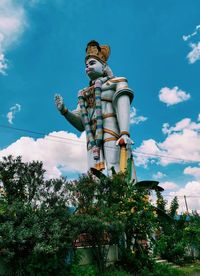 Low angle view of statue against sky