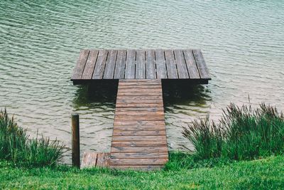 Wooden posts on lake