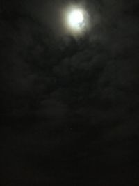 Low angle view of moon in sky at night