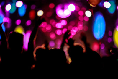 Close-up of hands at night