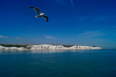 Scenic view of sea against cloudy sky