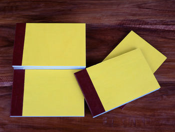 High angle view of yellow paper on table