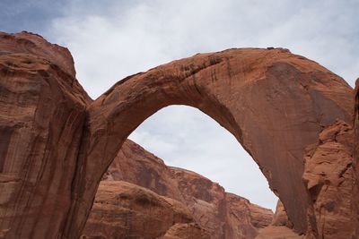 Low angle view of rock formation against sky