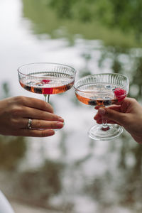 Cropped image of hand holding wine glass