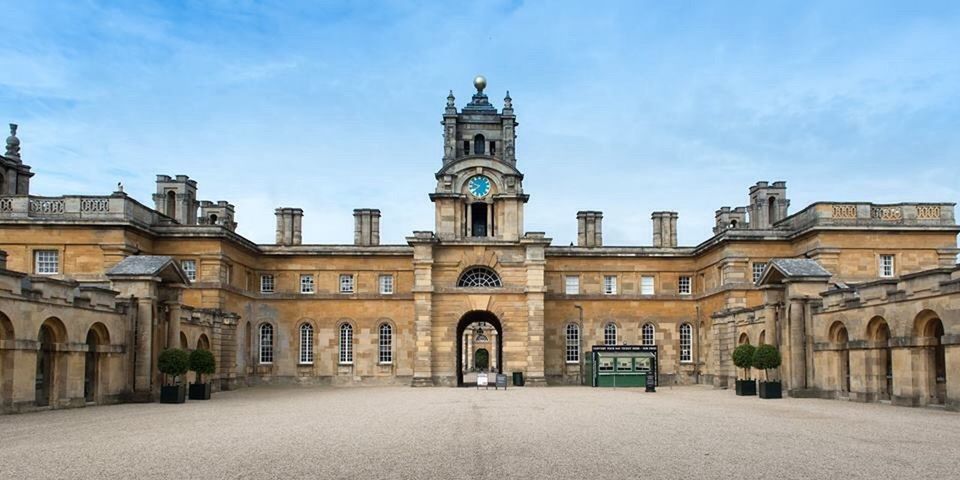 architecture, building exterior, built structure, facade, arch, sky, church, history, city, entrance, day, cloud, outdoors, blue, cloud - sky, place of worship, famous place, architectural feature, town hall