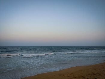 Scenic view of sea against clear sky during sunset