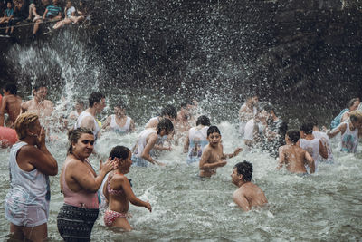 Group of people enjoying in water