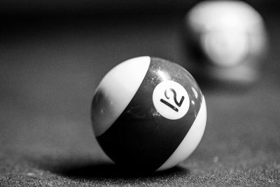 Close-up of pool ball on table