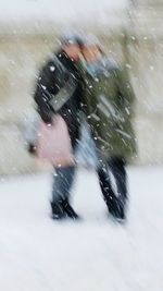 Blurred motion of people on road