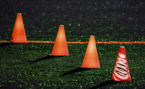 Illuminated cones on soccer field at night