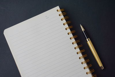 High angle view of pen on table against black background