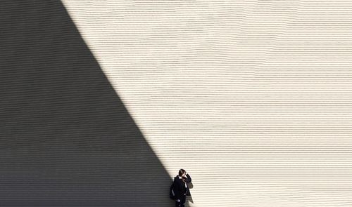 Woman standing against wall