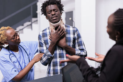 Portrait of business colleagues stacking hands