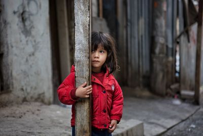 Portrait of cute girl standing outdoors