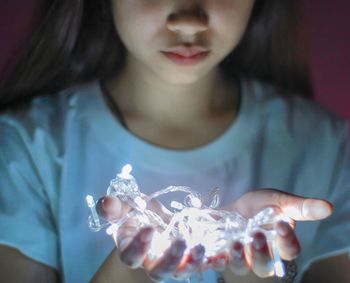 Close-up of woman holding girl