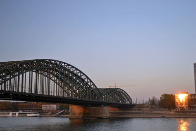 Bridge over river with buildings in background