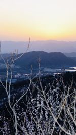 Scenic view of land against sky during sunset