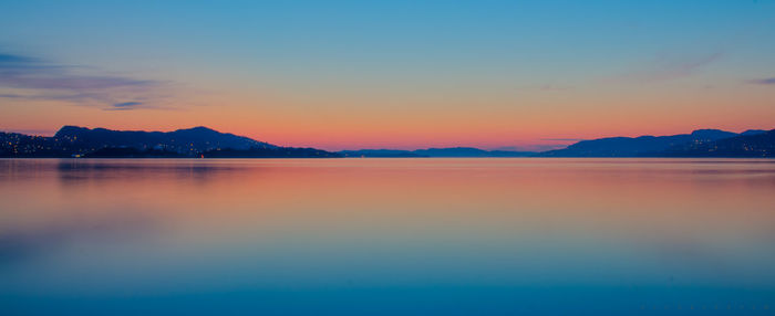 Scenic view of calm sea at sunset