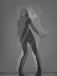 Woman standing in the dark