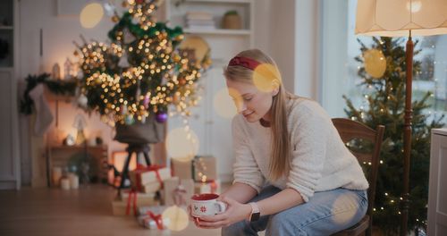 Portrait of woman relaxing during christmas