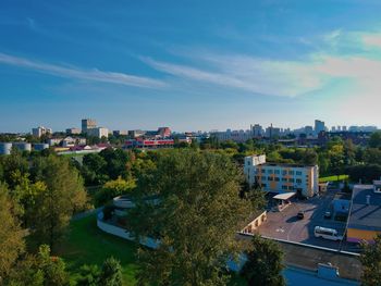 High angle view of trees and buildings against sky