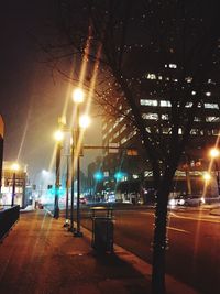 Illuminated city against sky at night