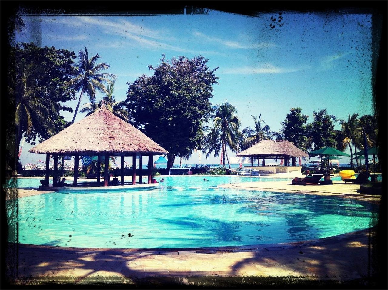 architecture, building exterior, built structure, transfer print, tree, auto post production filter, sky, palm tree, house, water, swimming pool, blue, tourist resort, beach, cloud - sky, residential structure, sunlight, cloud, nature, day