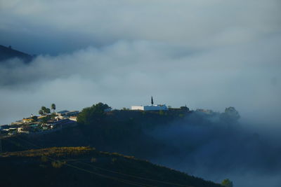 View of the town of la garnatilla on a foggy day from the mountain