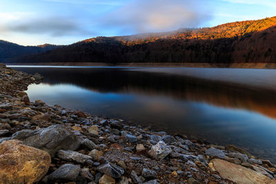 Scenic view of lake with mountains in background