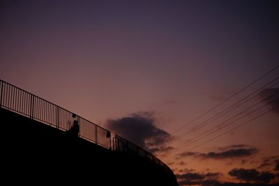 Silhouette bridge against sky during sunset