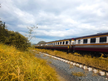 Train on railroad tracks against sky