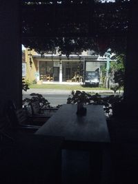 Trees and building seen through window