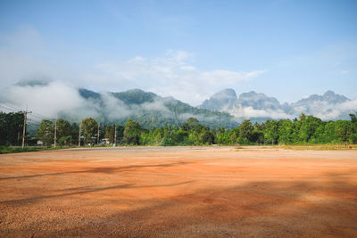 Scenic view of landscape against blue sky