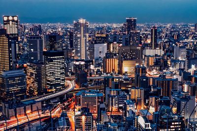 High angle view of illuminated buildings in city against sky