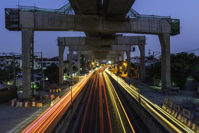 Light trails on railroad track at night