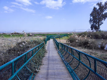 A photo of a wood and steel bridge across the naaman stream in northern israel