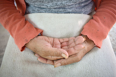 Midsection of woman with hands