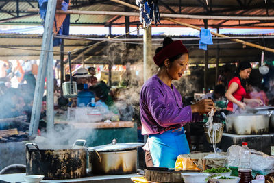 Group of people at market stall