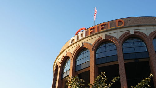 Low angle view of building against clear blue sky