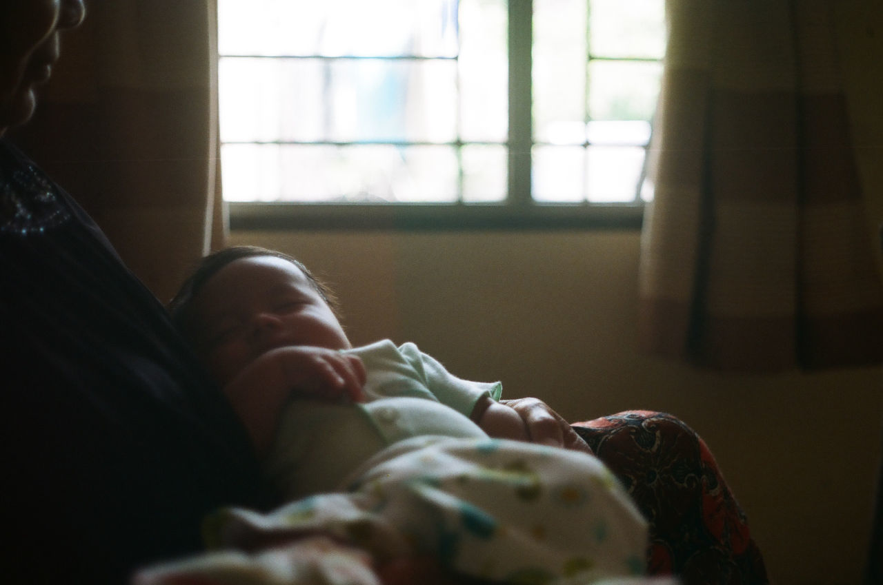 BOY SLEEPING ON BED