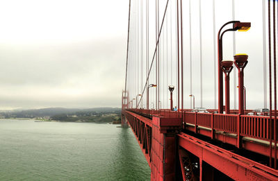 Golden gate bridge over sea against sky