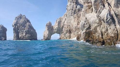 Panoramic view of sea against blue sky