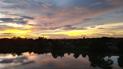 Scenic view of lake against sky during sunset