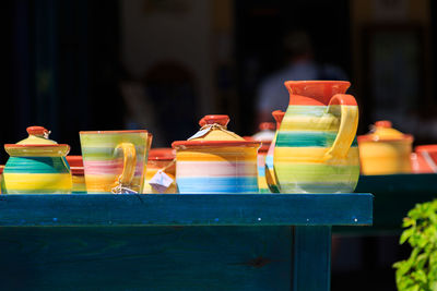 Close-up of multi colored crockery on table