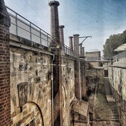 Low angle view of old building against sky