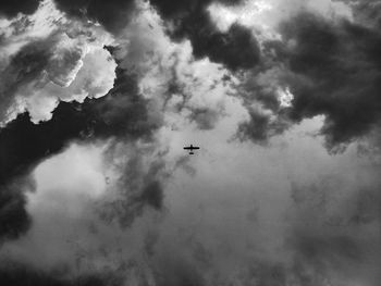 Low angle view of airplane flying in sky