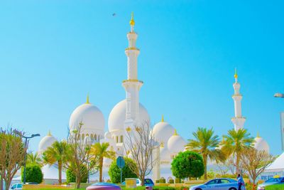 Grand mosque against clear blue sky