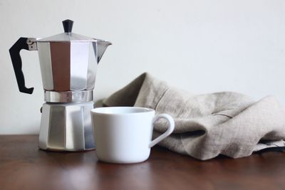 Close-up of coffee cup on table