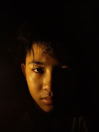 Portrait of mid adult man in darkroom