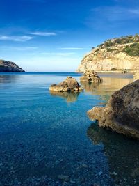 Scenic view of sea against blue sky